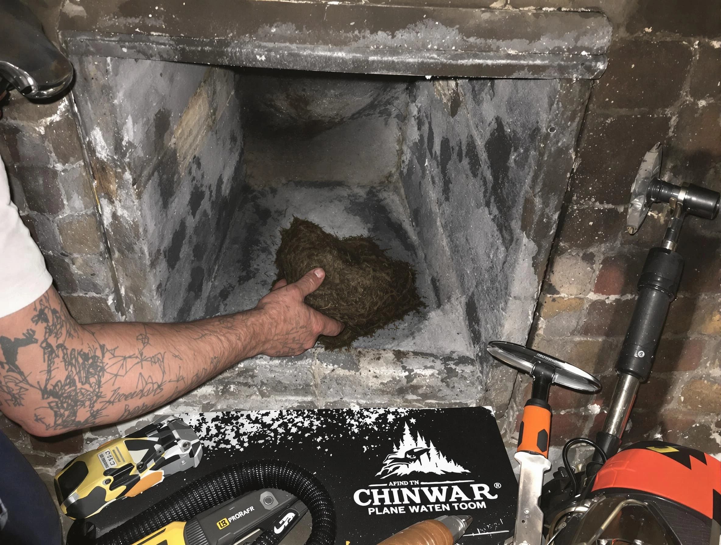 Marshfield Chimney Sweep safely removing debris and screening chimney in Marshfield, MA